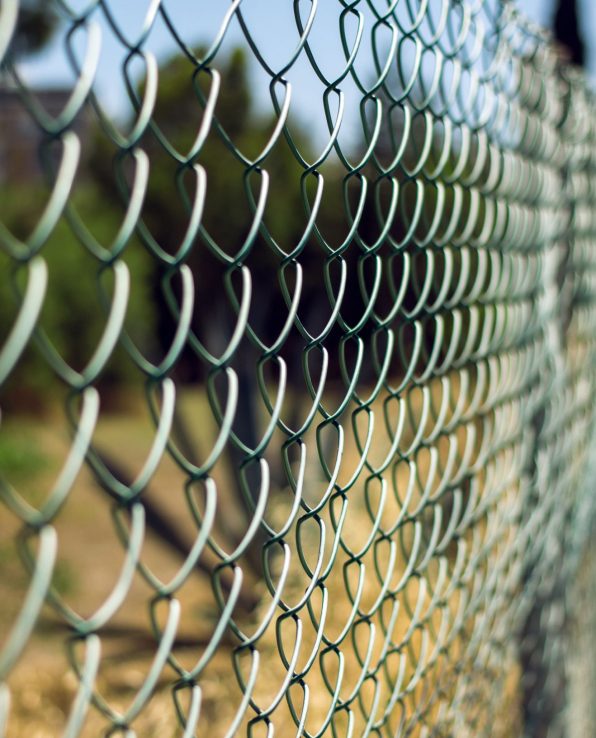 chain-link-fence-and-blurred-outdoor-background-2026-03-26-04-48-11-utc1