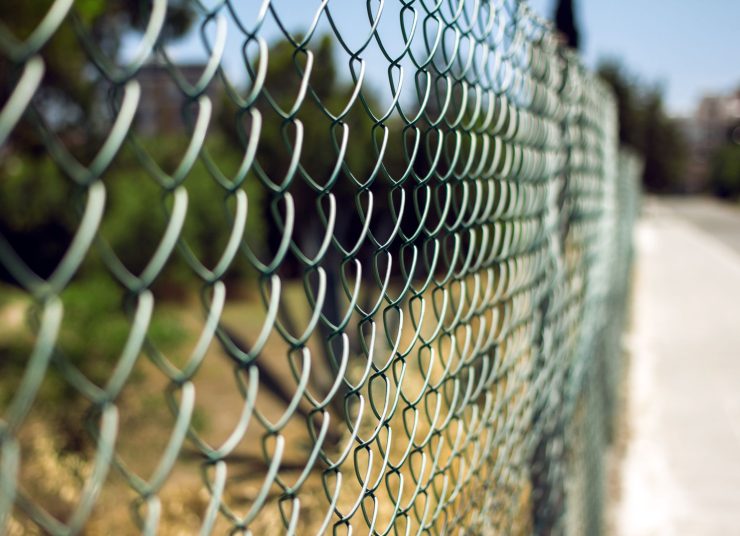 chain-link-fence-and-blurred-outdoor-background-2026-03-26-04-48-11-utc1